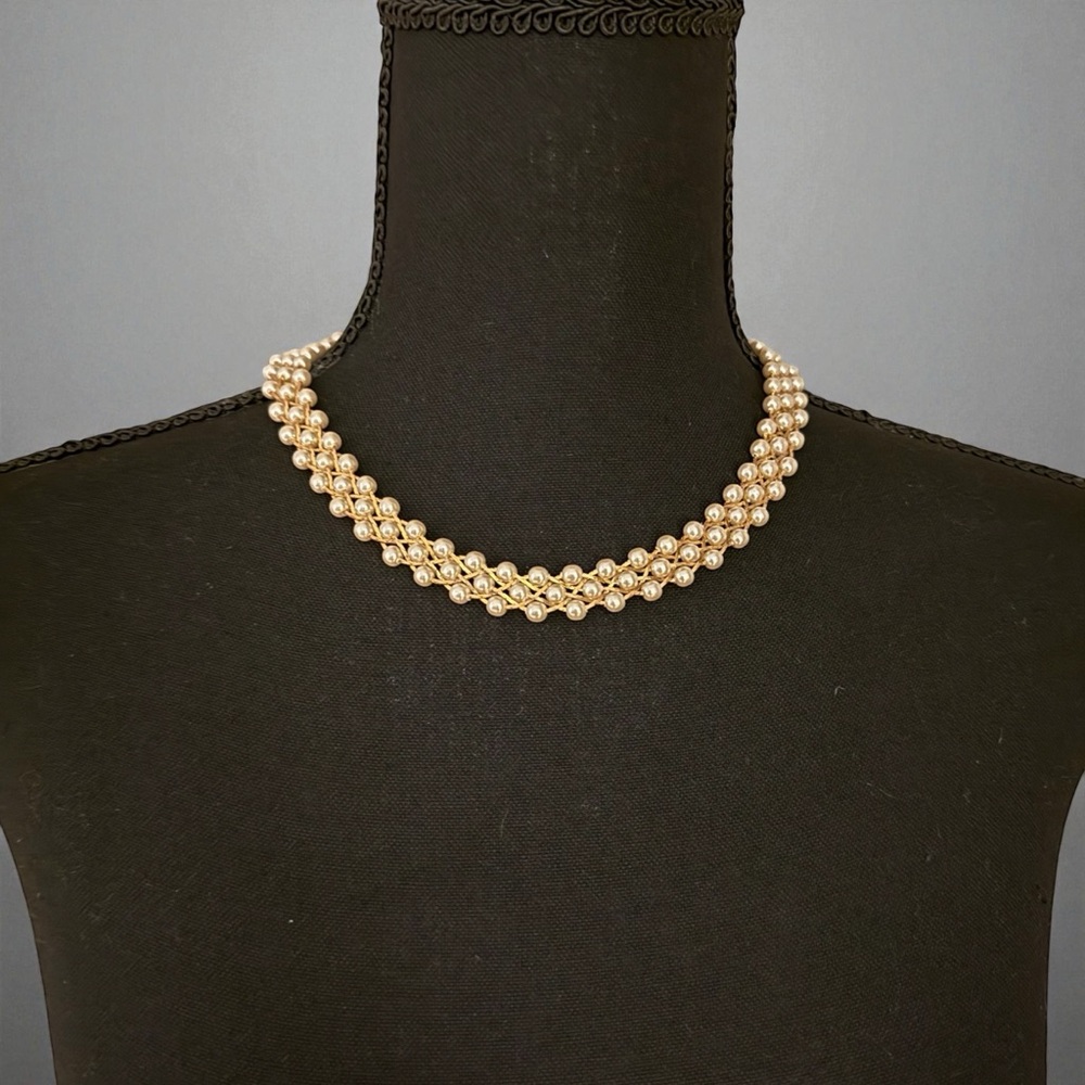 Braided Trifari gold-tone style necklace with faux pearls.